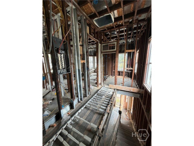 217 E 38th St is a completely gutted, two-story single-family - photo 10