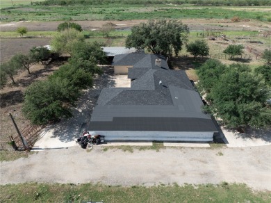 Discover this versatile 5-acre property featuring multiple