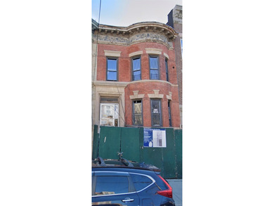 Vacant brick attached 2-family brownstone located in the Mount - photo 1