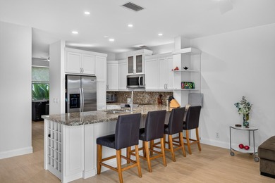 Welcome to this stunning waterfront residence nestled in The - photo 9