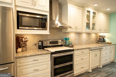 Welcome home to this beautifully maintained 4-bedroom, 2-bath - photo 27