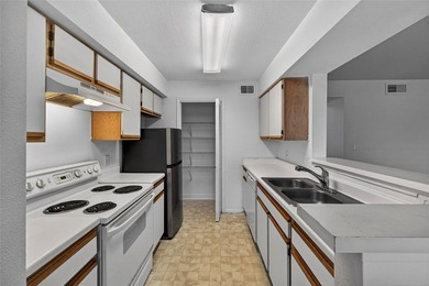 First-floor lakefront unit with screened patio in a gated - photo 3