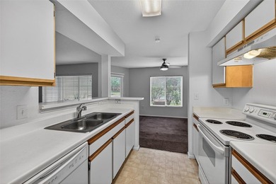 First-floor lakefront unit with screened patio in a gated - photo 4