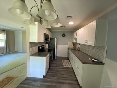 Beautifully Updated Greenbriar Model features 2 Bedrooms, 1 Full - photo 4