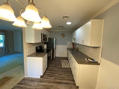 Beautifully Updated Greenbriar Model features 2 Bedrooms, 1 Full - photo 5
