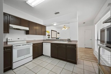 Welcome to this beautifully updated patio garden home in the - photo 23
