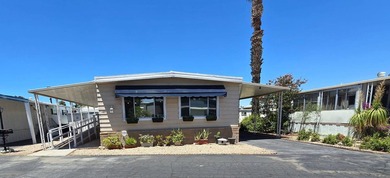 This beautiful and well-maintained manufactured home offers 2 - photo 1