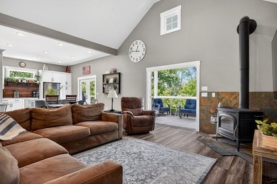 This waterfront lake home showcases an open floorplan and - photo 11