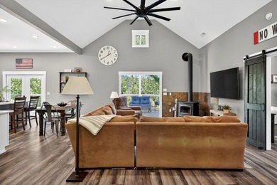 This waterfront lake home showcases an open floorplan and - photo 12
