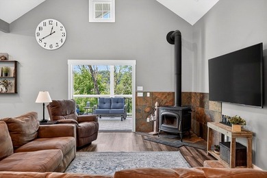 This waterfront lake home showcases an open floorplan and - photo 13