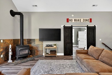 This waterfront lake home showcases an open floorplan and - photo 14