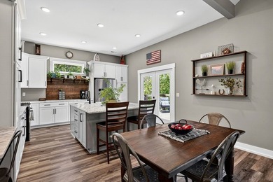 This waterfront lake home showcases an open floorplan and - photo 15