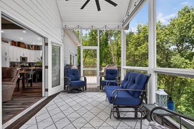This waterfront lake home showcases an open floorplan and - photo 23