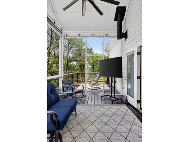 This waterfront lake home showcases an open floorplan and - photo 24