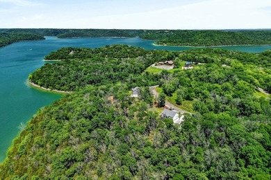 This waterfront lake home showcases an open floorplan and - photo 26