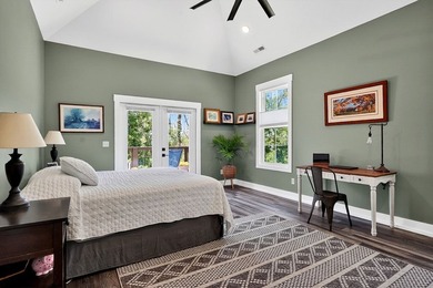 This waterfront lake home showcases an open floorplan and - photo 28
