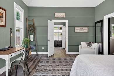 This waterfront lake home showcases an open floorplan and - photo 30
