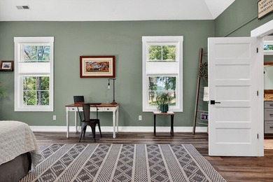 This waterfront lake home showcases an open floorplan and - photo 31