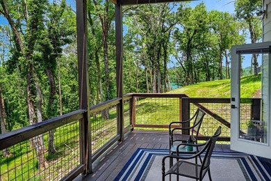 This waterfront lake home showcases an open floorplan and - photo 38