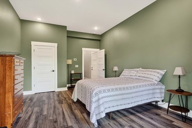 This waterfront lake home showcases an open floorplan and - photo 46
