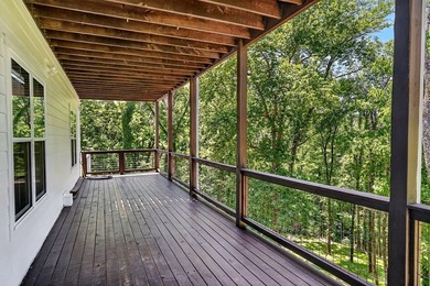 This waterfront lake home showcases an open floorplan and - photo 49