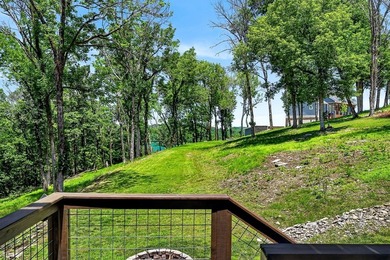 This waterfront lake home showcases an open floorplan and - photo 50