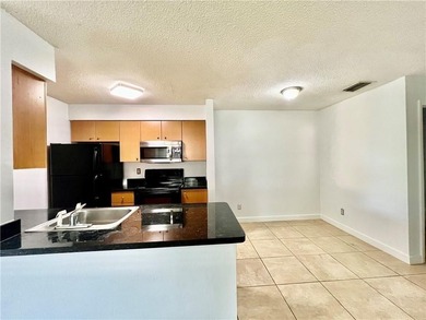 Vacant. all tile , granite countertop, 2 parking spaces - photo 3
