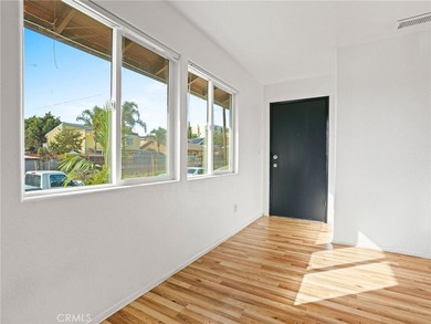 This beautifully updated 4-bedroom, 2-bathroom home with a 2-car - photo 4