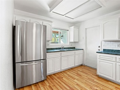 This beautifully updated 4-bedroom, 2-bathroom home with a 2-car - photo 8