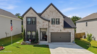 Welcome home to this beautifully designed five bedroom, two and - photo 1