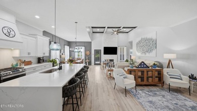 Welcome home to this beautifully designed five bedroom, two and - photo 5