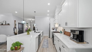 Welcome home to this beautifully designed five bedroom, two and - photo 10
