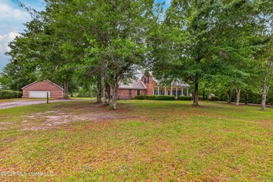 Escape to nearly three acres of serene privacy without - photo 2