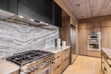 Indulge in exceptional lakefront living with 75 feet of private - photo 12