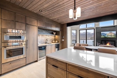 Indulge in exceptional lakefront living with 75 feet of private - photo 13