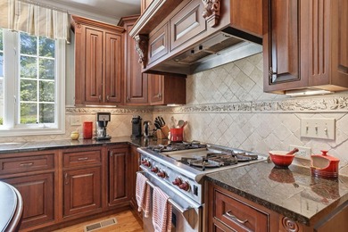 Perched along the golf course, this exceptional custom estate by - photo 19