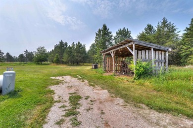 Set on 17 scenic acres in Michigan's Upper Peninsula, this - photo 31