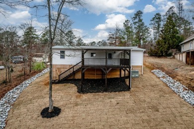 Beautifully renovated manufactured cottage home situated as a - Lake Home For Sale in Sparta, Georgia