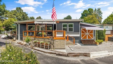 Experience mountain living at its finest in the highly - photo 1