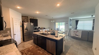 Welcome to this charming 4-bedroom, 2-bathroom home located in - photo 8