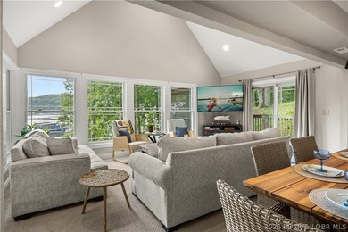 Discover peace and tranquility in this stunning lakefront home - photo 12