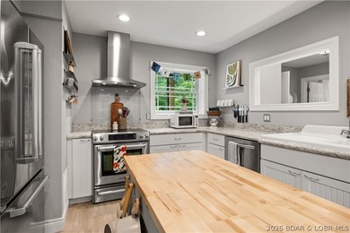 Discover peace and tranquility in this stunning lakefront home - photo 18