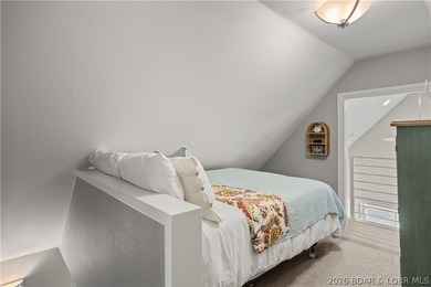 Discover peace and tranquility in this stunning lakefront home - photo 21