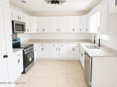 This beautifully updated 4-bedroom, 2-bath home is located in a - photo 6