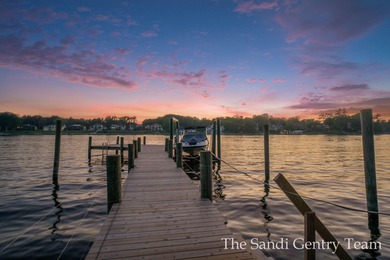 WITH OVER 400' OF PRIME SPRING LAKE WATER FRONTAGE SITS THIS - photo 8