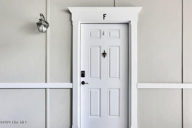 This desirable end-unit condominium offers a light-filled layout