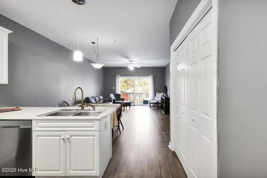 This desirable end-unit condominium offers a light-filled layout