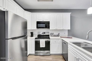 This desirable end-unit condominium offers a light-filled layout