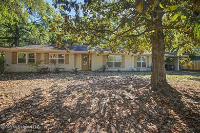 Tucked away on a quiet, tree-lined street, this beautifully - photo 1