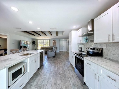 Experience the coastal lifestyle in this exquisitely upgraded - photo 12